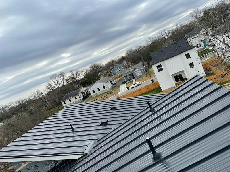 Standing seam metal roof panels with vents for Skylight Repair in Holly Springs